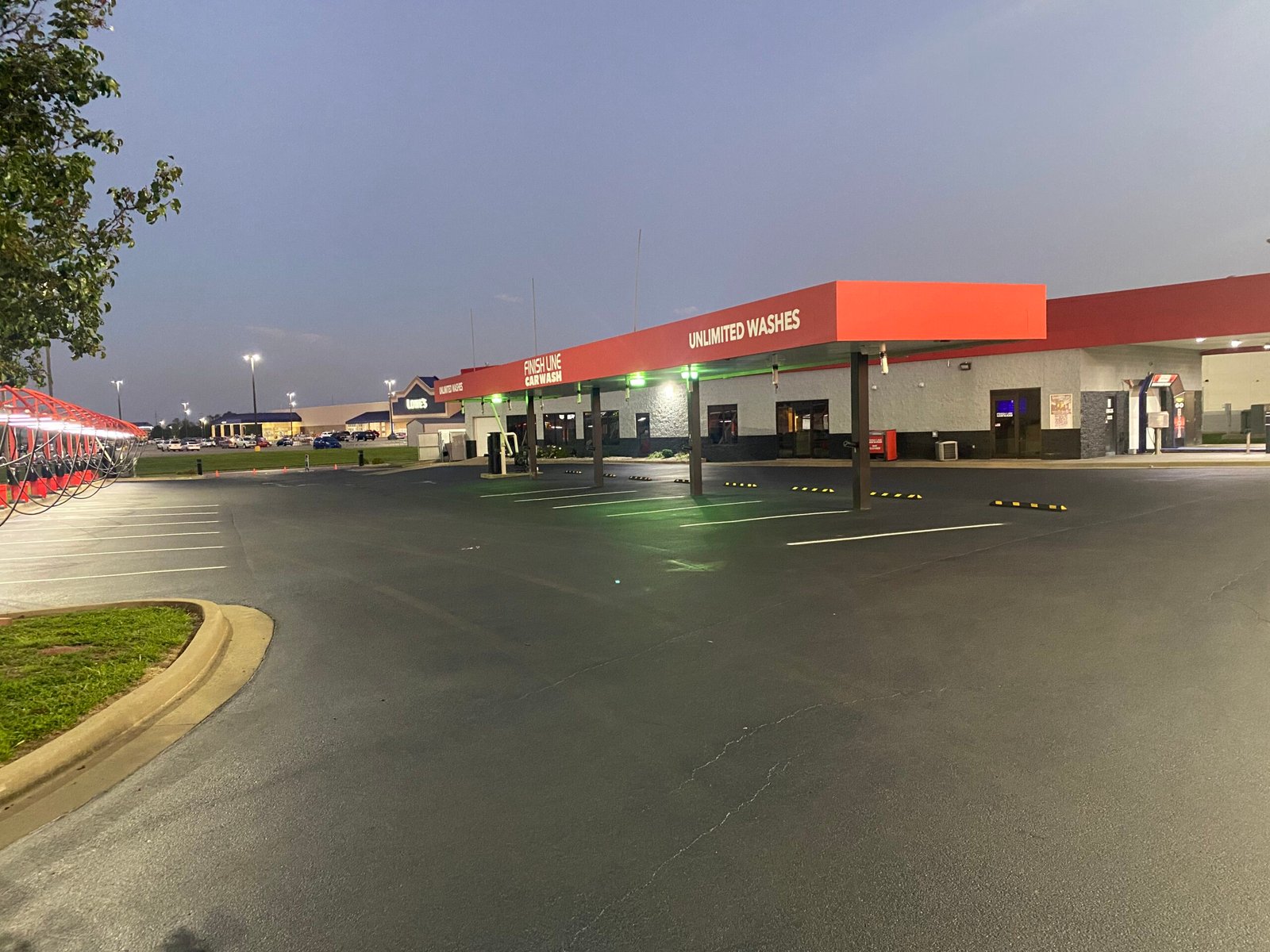 Asphalt Paving in Evansville, IN Sealcoated and striped car wash parking lot near Evansville Indiana