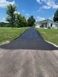 Tell City driveway after entrance repair, patching and sealcoating