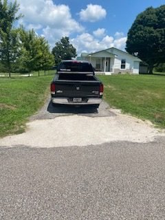 Tell City driveway entrance before repair and sealcoating
