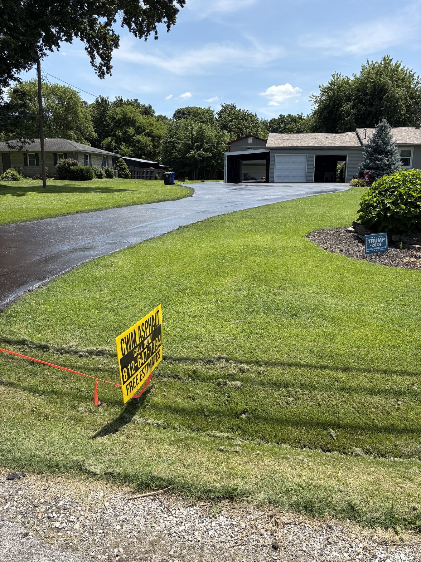Asphalt Paving & Sealcoating in Newburgh, IN Freshly sealcoated residential asphalt driveway in Newburgh Indiana