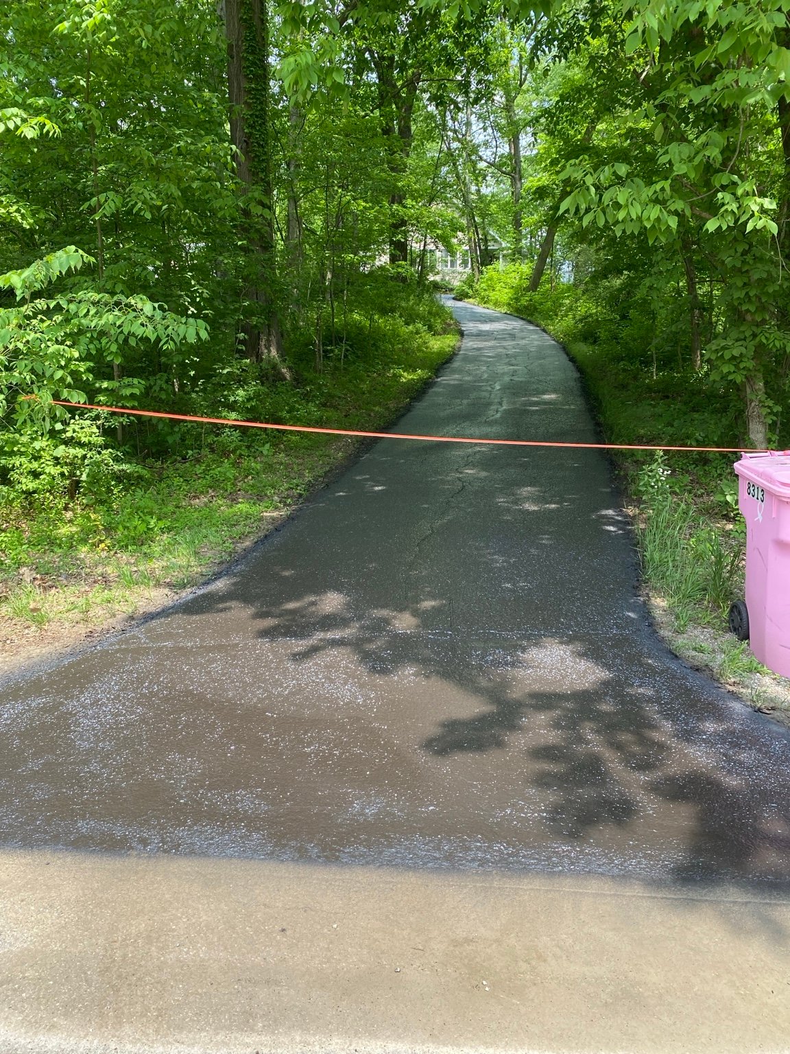 Fresh sealcoat on a residential driveway in Henderson County
